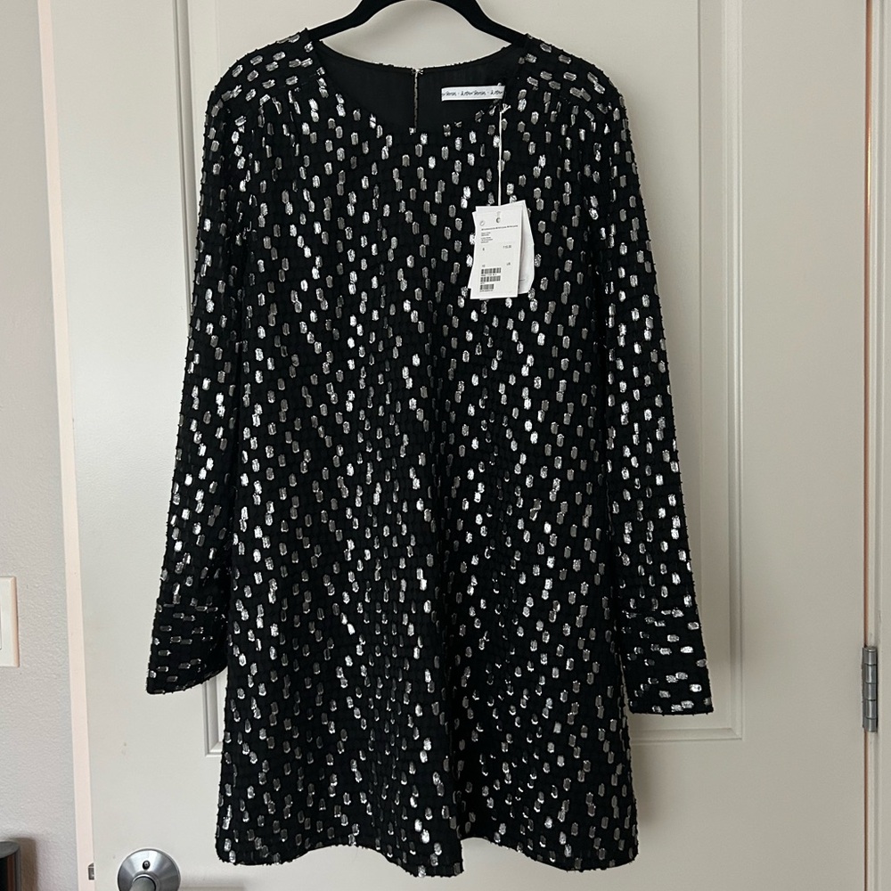 Brand new black and silver long sleeve shift cocktail dress